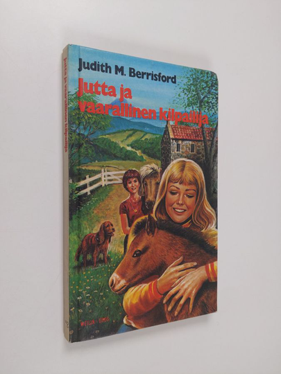 Judith M. Berrisford : Jutta ja vaarallinen kilpailija : tyttöromaani